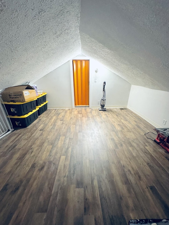 6002 Edmonton Rd, Columbia, KY 42728 - bonus room featuring a textured ceiling, wood finished floors, lofted ceiling, and baseboards