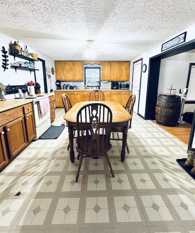 6002 Edmonton Rd, Columbia, KY 42728 - dining room featuring light floors and a textured ceiling
