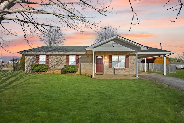 view of front of house with a porch and a lawn