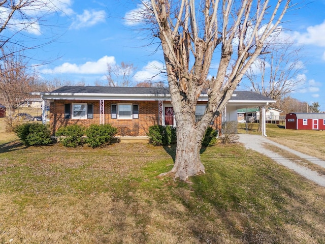 ranch-style house with a carport and a front yard