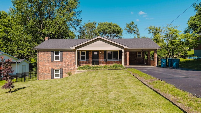 665 Linda Ave, Danville, KY 40422 - view of front of property with asphalt driveway, brick siding, a chimney, and an attached carport