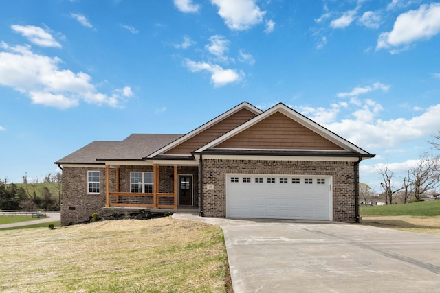 view of front of house featuring covered porch, concrete driveway, an attached garage, brick siding, and a front lawn