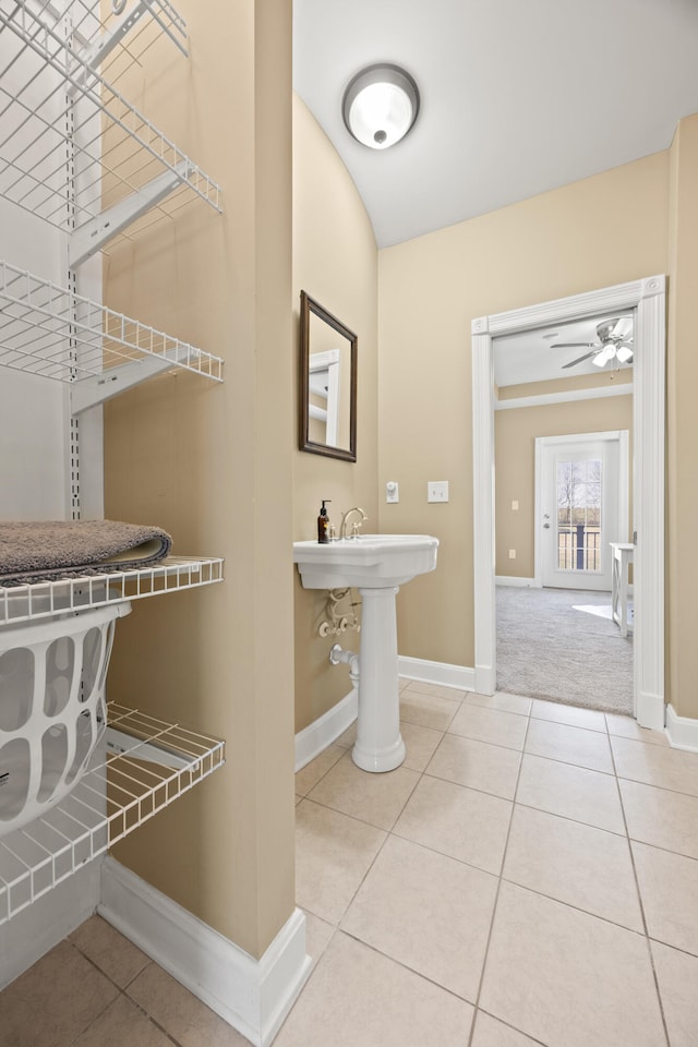 bathroom featuring tile patterned flooring, ceiling fan, and baseboards