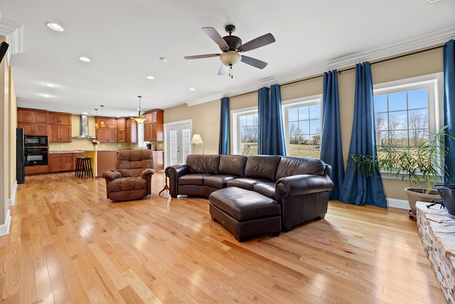 living room featuring recessed lighting, french doors, light wood-type flooring, and ceiling fan