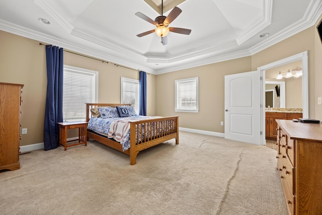 bedroom featuring a tray ceiling, baseboards, light colored carpet, and crown molding