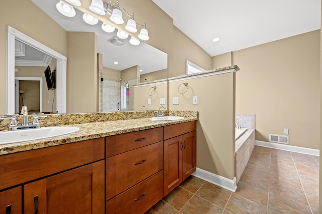 bathroom featuring a sink, visible vents, double vanity, and a shower stall