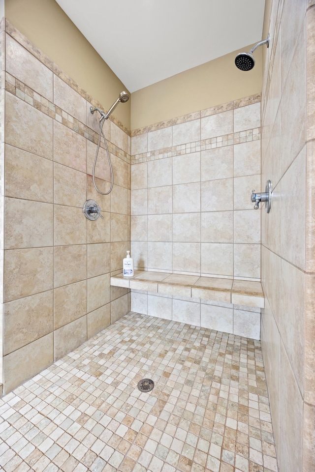 full bathroom featuring tiled shower