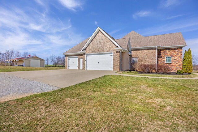 ranch-style home featuring a front yard, roof with shingles, an attached garage, concrete driveway, and brick siding