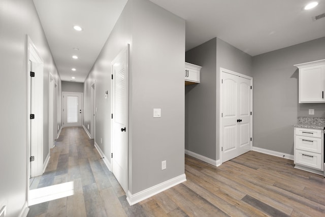 corridor with dark hardwood / wood-style floors