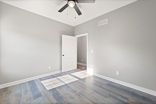 unfurnished room featuring hardwood / wood-style flooring and ceiling fan