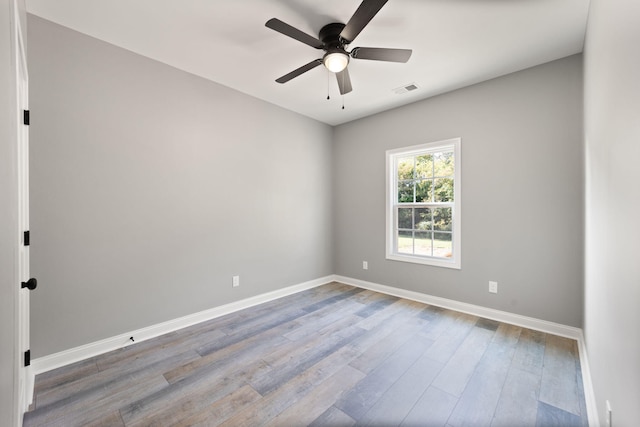 empty room with wood-type flooring and ceiling fan