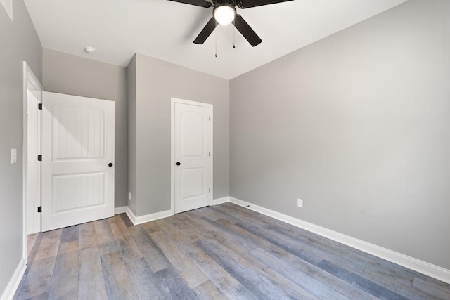 unfurnished bedroom with wood-type flooring and ceiling fan