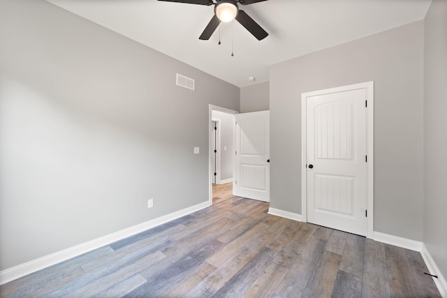 unfurnished bedroom with ceiling fan and light hardwood / wood-style floors