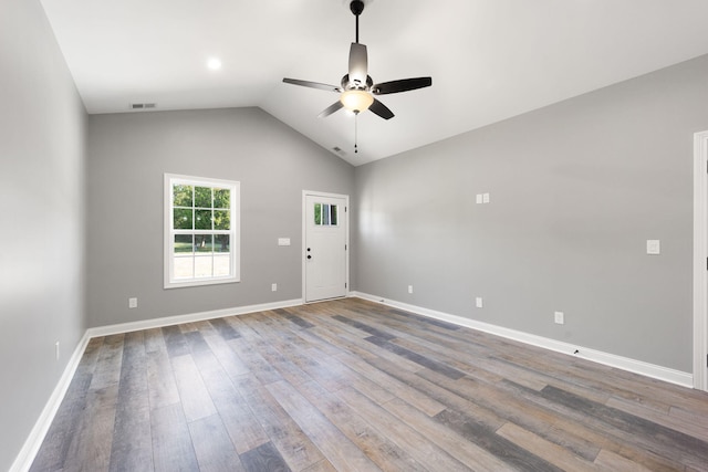 unfurnished room featuring wood-type flooring, vaulted ceiling, and ceiling fan