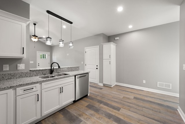 kitchen with sink, white cabinetry, light stone counters, dishwasher, and ceiling fan