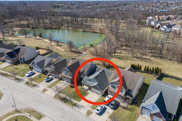 bird's eye view with a water view and a residential view