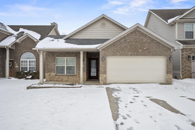 view of front of house featuring a garage and brick siding