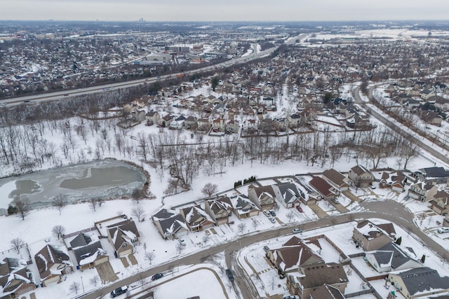 snowy aerial view featuring a residential view