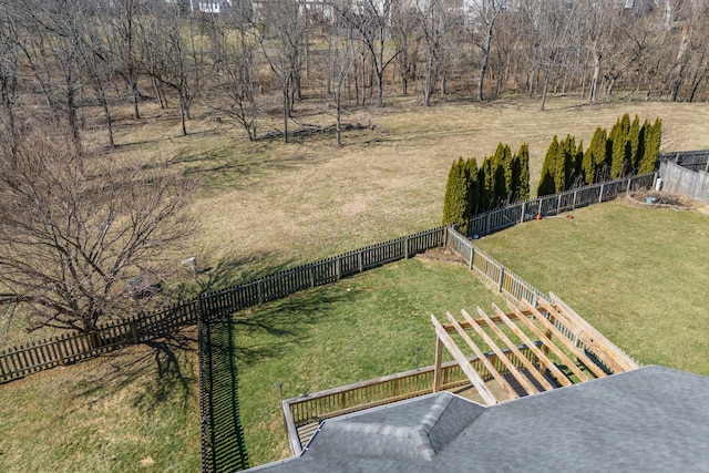 view of yard with fence and a rural view