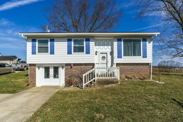 raised ranch featuring french doors and a front yard