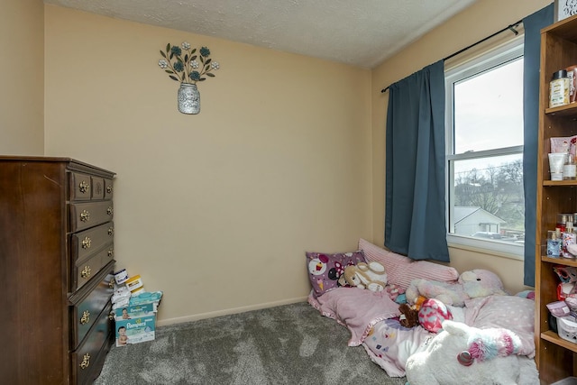 unfurnished bedroom with dark carpet and a textured ceiling