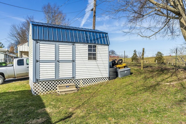 view of outdoor structure with a lawn