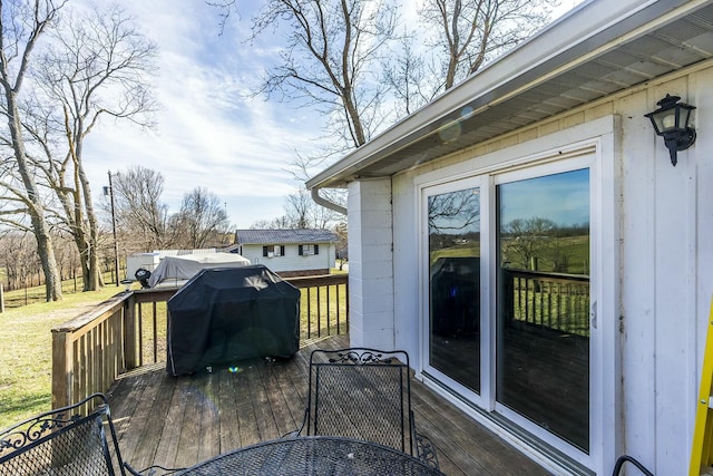 wooden deck with area for grilling