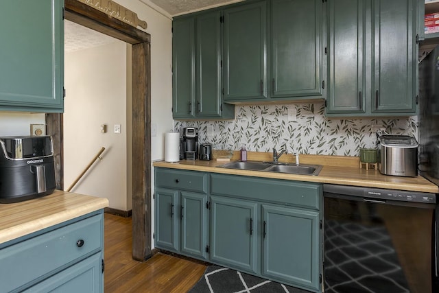 kitchen with dark hardwood / wood-style flooring, sink, beverage cooler, and a textured ceiling