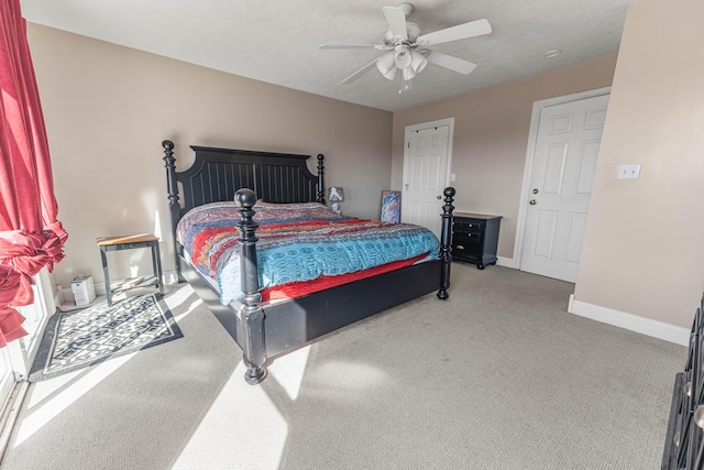 bedroom featuring ceiling fan, carpet flooring, and baseboards