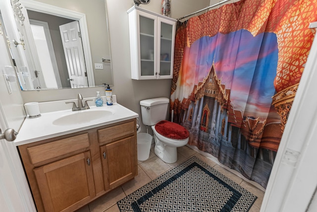 bathroom featuring toilet, vanity, and tile patterned floors