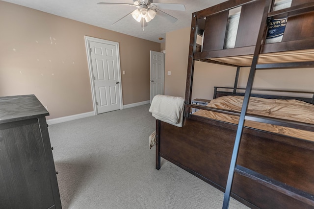 unfurnished bedroom featuring baseboards and light colored carpet