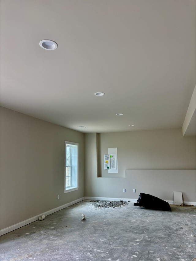unfurnished room featuring baseboards and recessed lighting