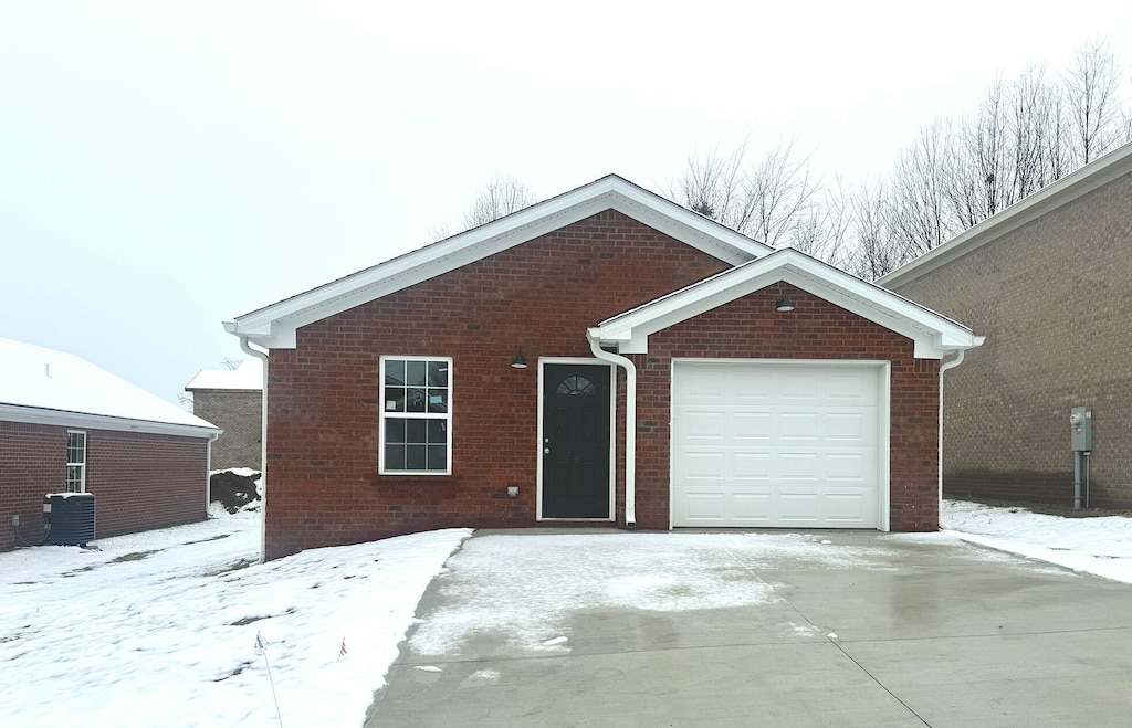 313 Baughman Ave Unit 8, Danville, KY 40422 - ranch-style home with brick siding, concrete driveway, a garage, and central AC unit