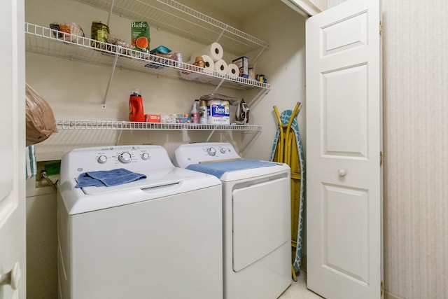 washroom featuring independent washer and dryer