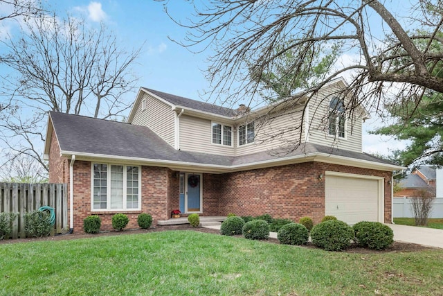 front facade featuring a front yard and a garage