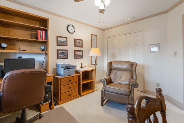 home office with ceiling fan, crown molding, and light carpet