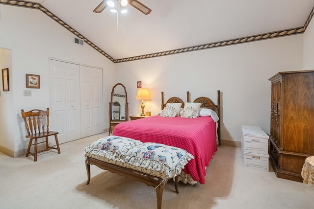 bedroom featuring high vaulted ceiling, a closet, ceiling fan, and light colored carpet