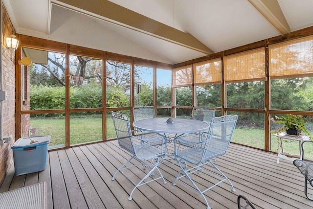 unfurnished sunroom with lofted ceiling