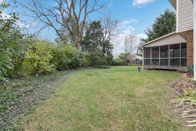 view of yard featuring a sunroom