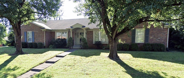 ranch-style house featuring a front lawn