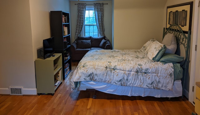 bedroom featuring hardwood / wood-style floors