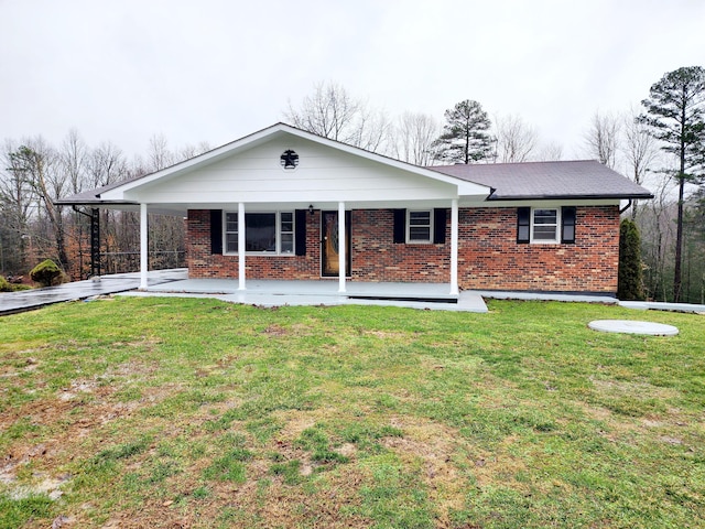 ranch-style house with a front yard and a porch