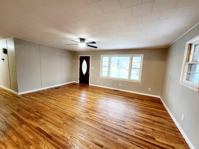 foyer featuring light hardwood / wood-style flooring and ceiling fan