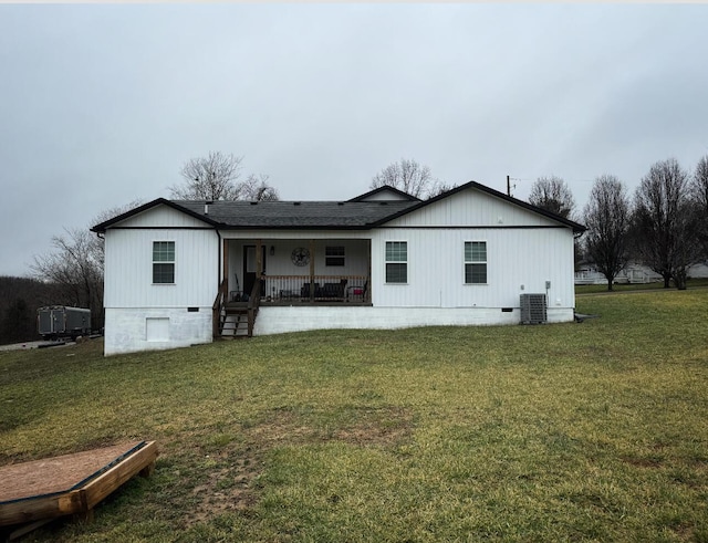 back of property featuring a lawn, a porch, cooling unit, a shingled roof, and crawl space