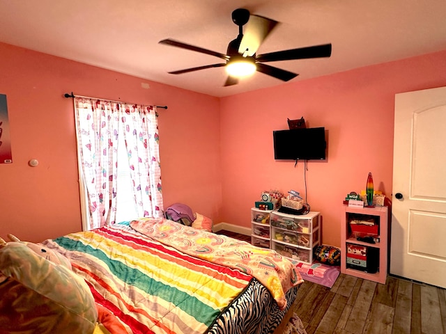 bedroom featuring wood finished floors and ceiling fan