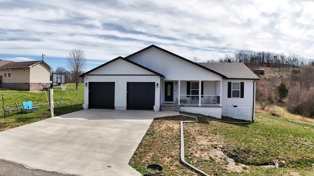 view of front facade featuring a garage, driveway, a porch, and a front yard