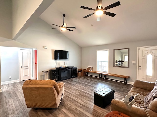 living room with baseboards, high vaulted ceiling, ceiling fan, and wood finished floors