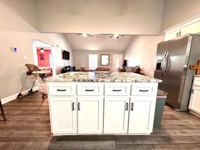 kitchen with dark wood finished floors, white cabinets, a ceiling fan, and stainless steel fridge