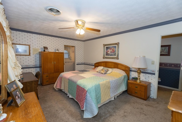 carpeted bedroom with ornamental molding and ceiling fan