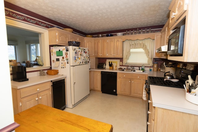 kitchen featuring light brown cabinetry, sink, a textured ceiling, and black appliances